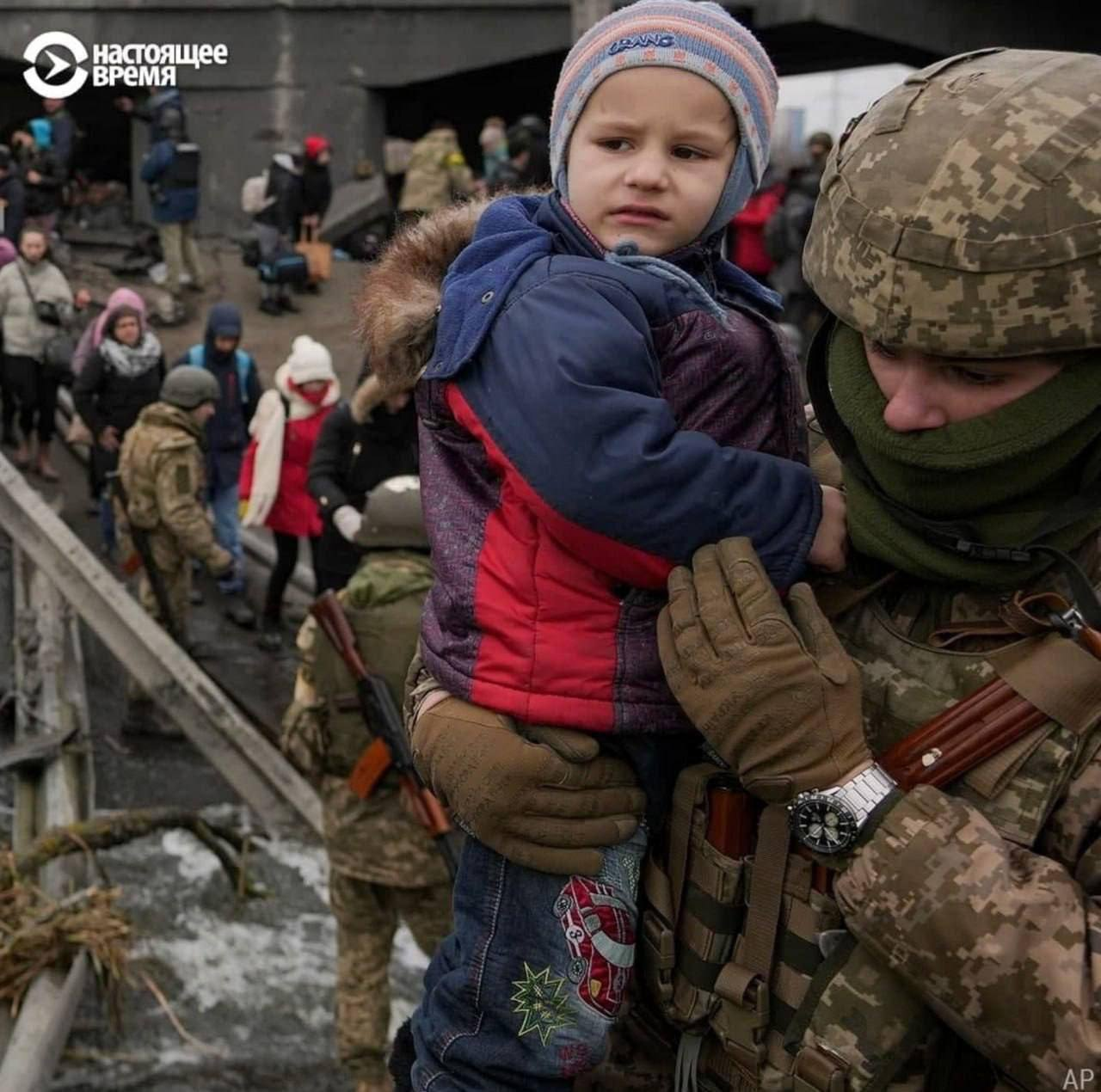 The same soldier on the original photo with the whole original background - a collapsed bridge and many civilians